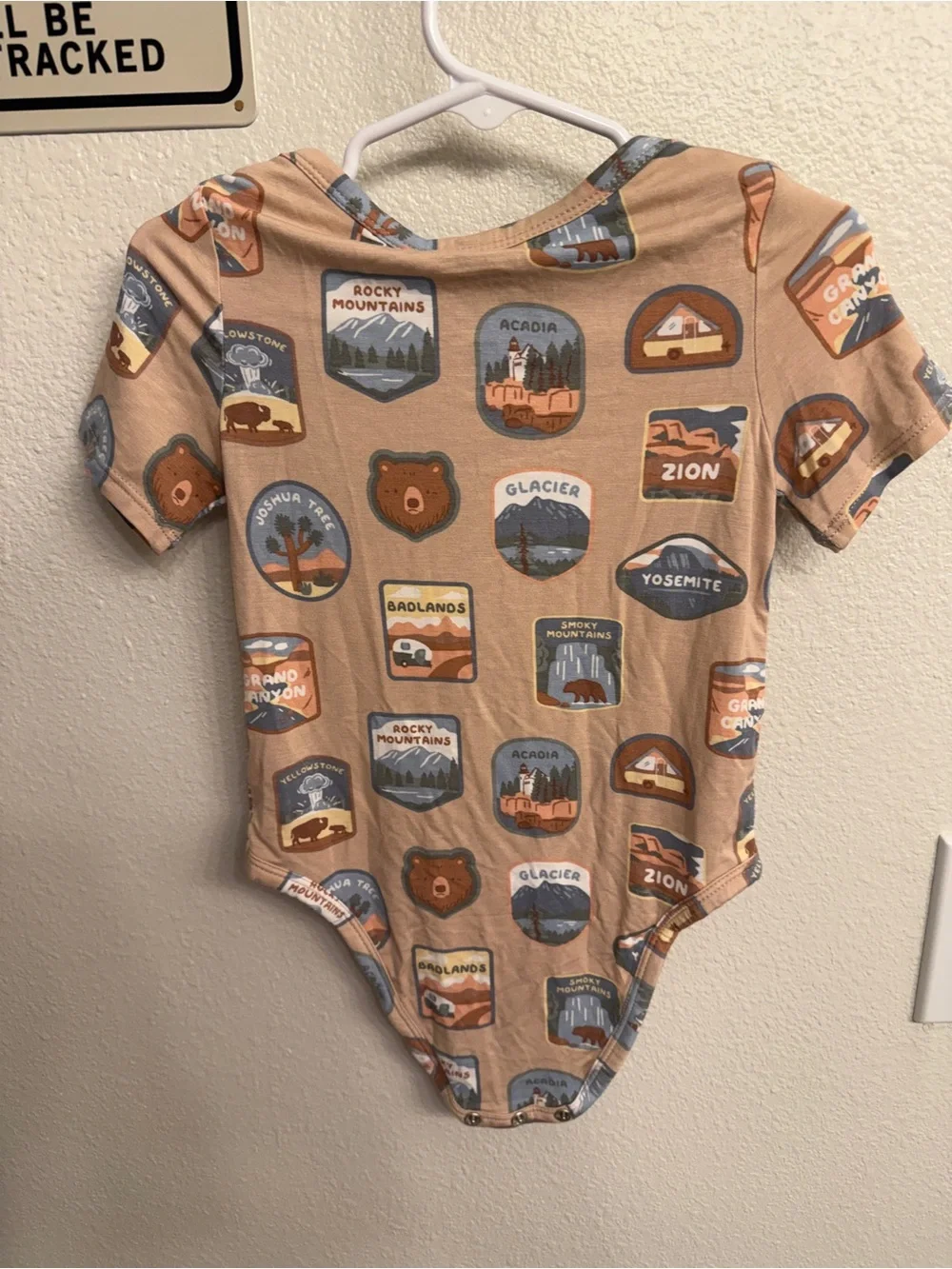 Angel Dear Tan National Parks Badge Print One-Piece